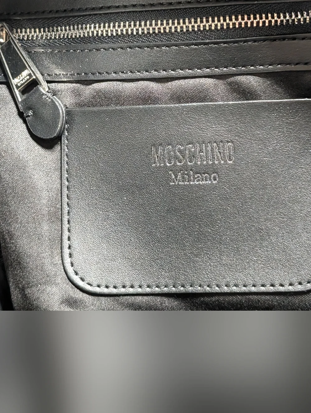 Moschino Interlocking clamp print backpack